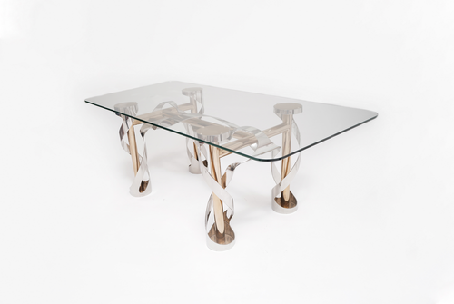 A Dining table shown in polished stainless steel and bronze with clear tempered glass.